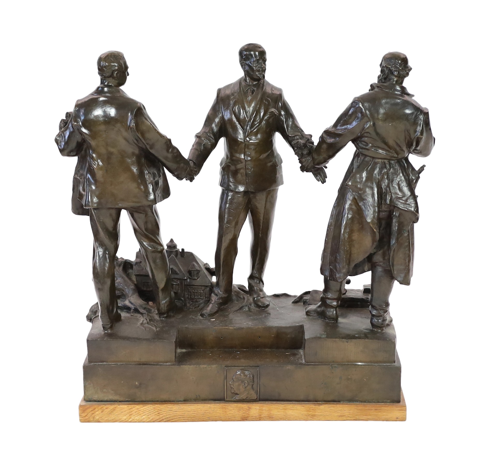 Ladislav Jan Šaloun (Czech, 1870-1946) a large bronze group of a dignitary greeting two men, early 20th century, 72cm high, 64.5cm wide